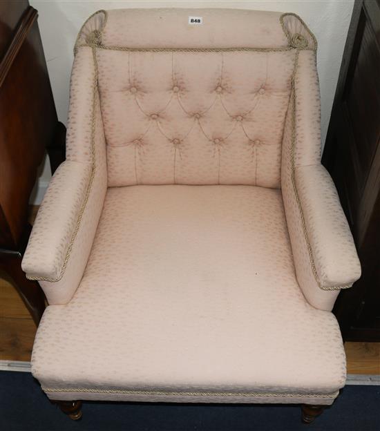 A Victorian buttoned low armchair